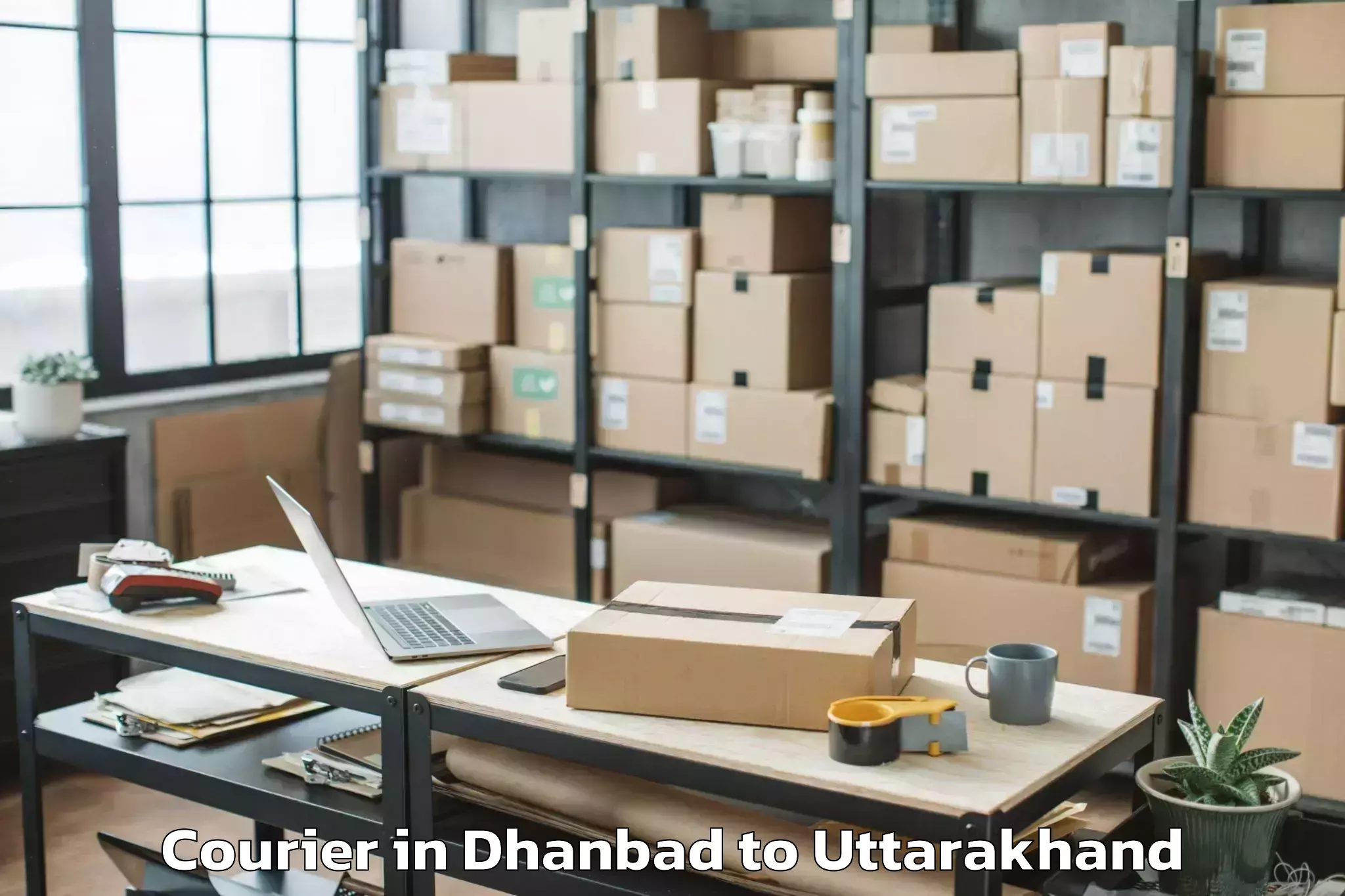 Dhanbad to Hemwati Nandan Bahuguna Uttara Courier Booking